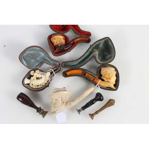 526 - Three antique letter seals with carved intaglio seals and four meerschaum smoking pipes.