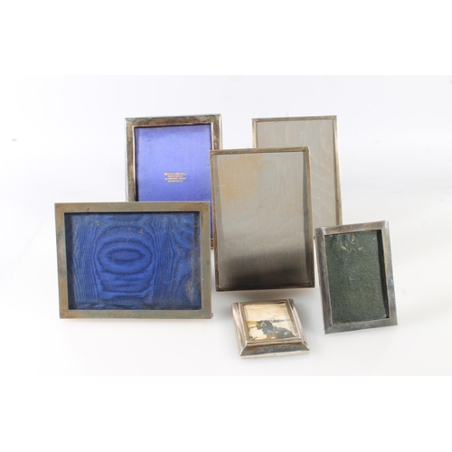 167 - Pair of silver photograph frames with easel backs 16cm x 11cm and four others. (6)