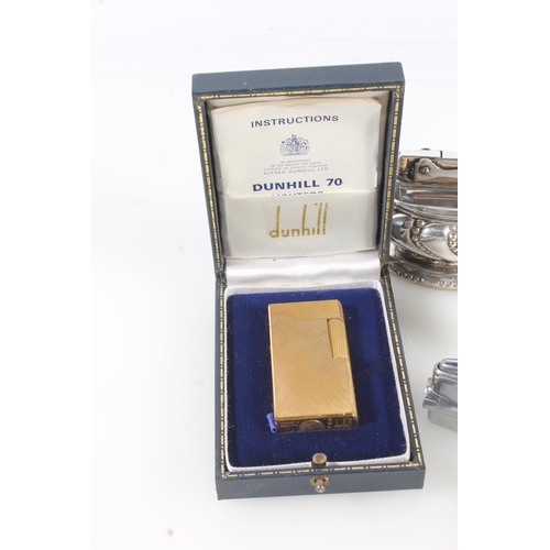 524 - Dunhill 70 FQ880 gilt metal pocket lighter in original case, three Ronson table lighters Crown, Quee... 