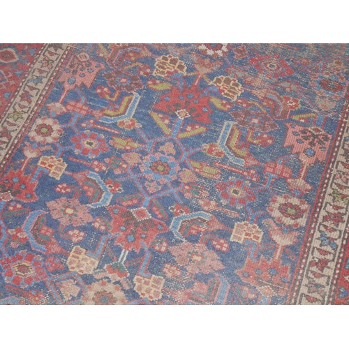 597 - Persian Bidjar rug with floral design, 184cm x 108cm.