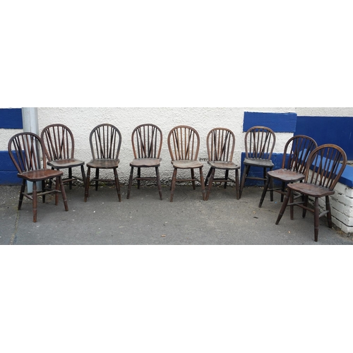 584 - Set of eight elm and oak Windsor type hoop back chairs.