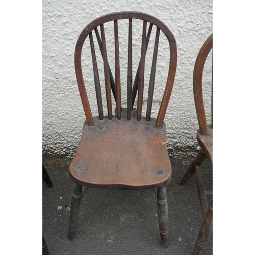 584 - Set of eight elm and oak Windsor type hoop back chairs.