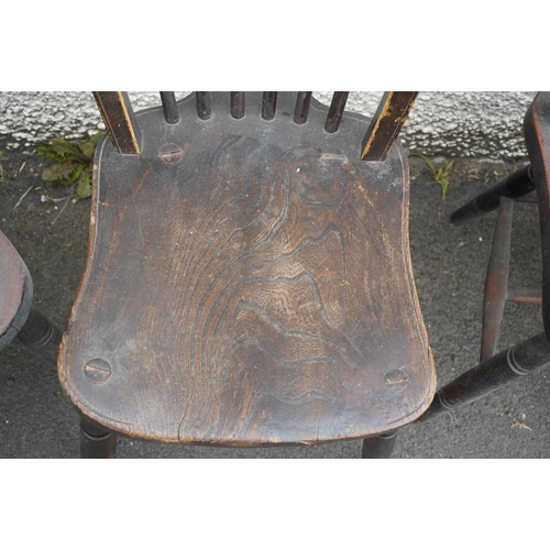 584 - Set of eight elm and oak Windsor type hoop back chairs.