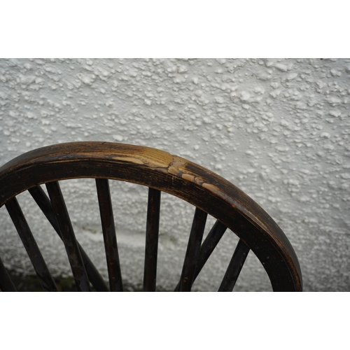 584 - Set of eight elm and oak Windsor type hoop back chairs.