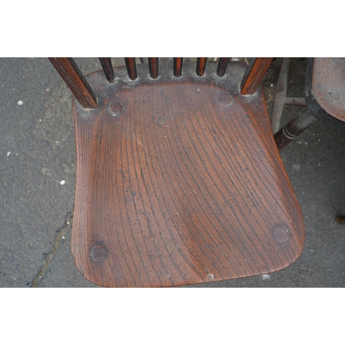 584 - Set of eight elm and oak Windsor type hoop back chairs.