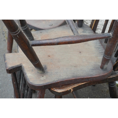 584 - Set of eight elm and oak Windsor type hoop back chairs.