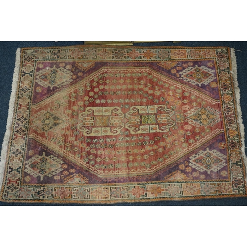 593 - Turkish ushak rug, the red ground central lozenge surrounded by four burgundy corners and geometric ... 