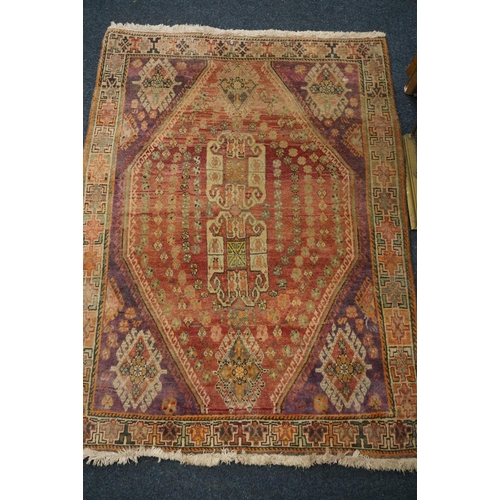 593 - Turkish ushak rug, the red ground central lozenge surrounded by four burgundy corners and geometric ... 