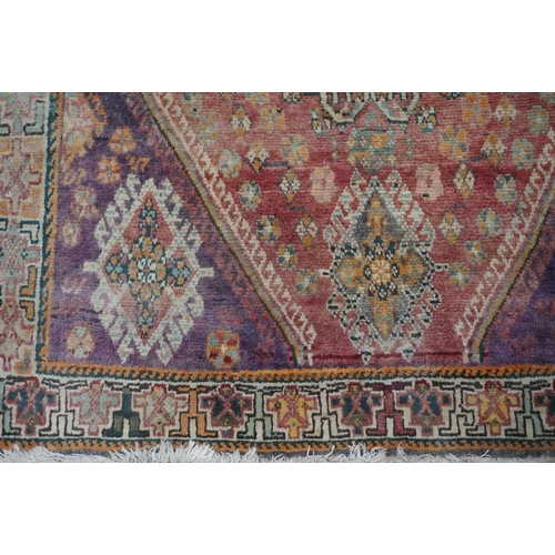 593 - Turkish ushak rug, the red ground central lozenge surrounded by four burgundy corners and geometric ... 