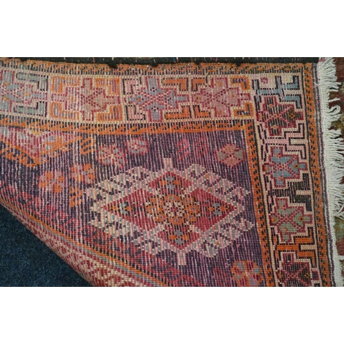 593 - Turkish ushak rug, the red ground central lozenge surrounded by four burgundy corners and geometric ... 