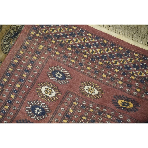 596 - Bokhara style rug. The central field decorated with three rows of twelve gul,  178cm x 130cm.