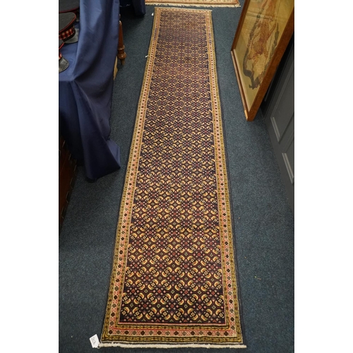 598 - Persian runner with all over geometric design, 383cm x 74cm.