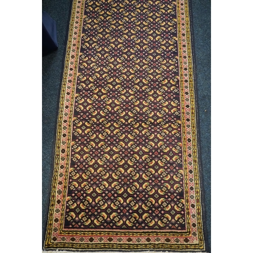 598 - Persian runner with all over geometric design, 383cm x 74cm.