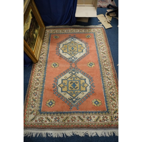 599 - Turkish Konya style rug, the central field decorated with two lozenges,  190cm x 137cm.