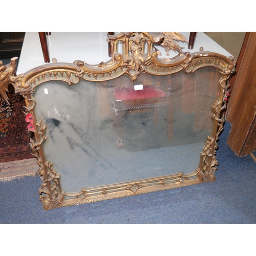 586 - Antique gilt wood overmantel wall mirror with scroll and foliate borders, the top rail with central ... 