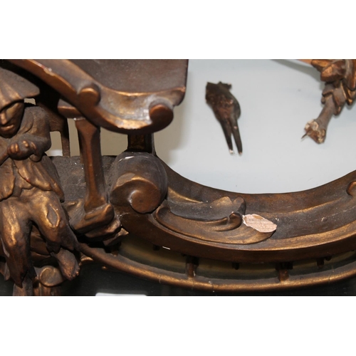 586 - Antique gilt wood overmantel wall mirror with scroll and foliate borders, the top rail with central ... 