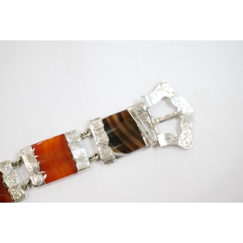 191 - Scottish pebble set white metal bracelet of buckle and strap form set with banded agate, probably si... 