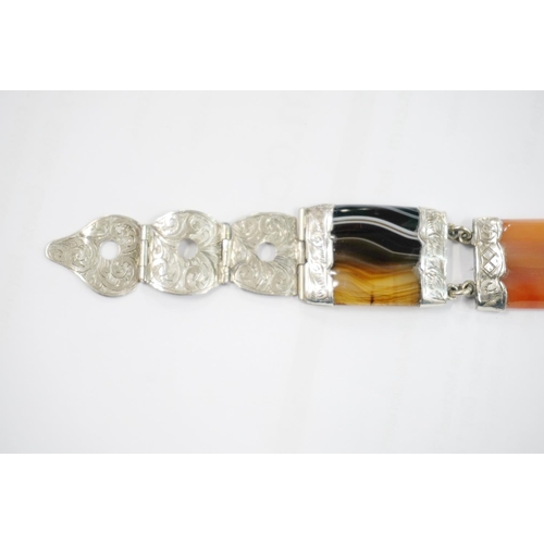 191 - Scottish pebble set white metal bracelet of buckle and strap form set with banded agate, probably si... 