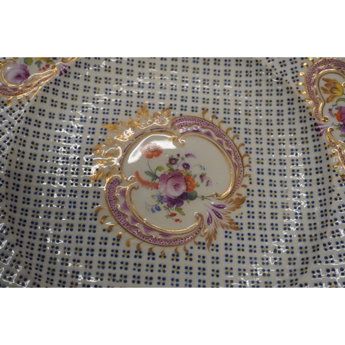 477 - Set of 12 19th century porcelain plates painted with vignettes of flowers against a uniform dot grid... 