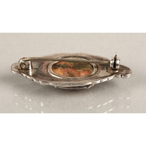 57 - Assorted brooches silver and gem set to include an orange gem set plaid brooch, a silver luckenbooth... 