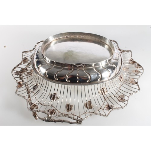 61 - George II silver swing handled basket of superb quality, of oval form having fruiting grape vine dec... 