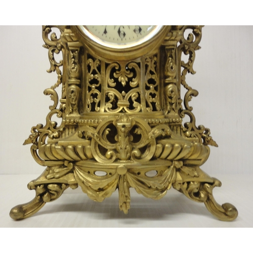 302 - French brass three-piece clock garniture in the Rococo taste, 20th century, comprising a large brack... 