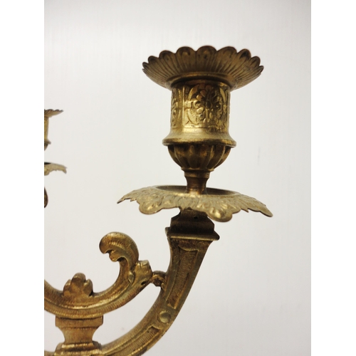 302 - French brass three-piece clock garniture in the Rococo taste, 20th century, comprising a large brack... 