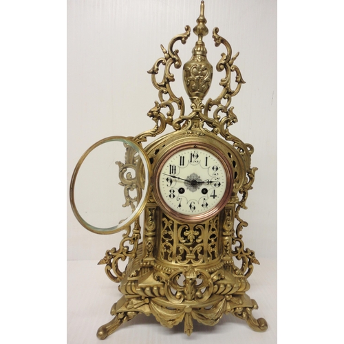 302 - French brass three-piece clock garniture in the Rococo taste, 20th century, comprising a large brack... 