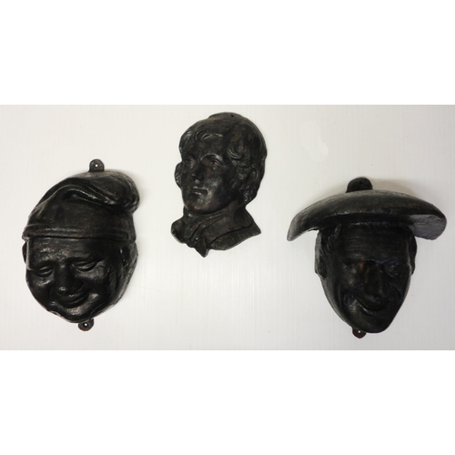 376 - Three painted cast iron exterior wall masks modelled as Robert Burns, Tam o' Shanter and Souter John... 