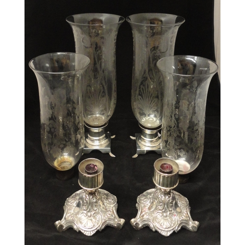 333 - Two pairs of glass trumpet vases decorated with applied Victorian-style scrolls and foliage, on whit... 