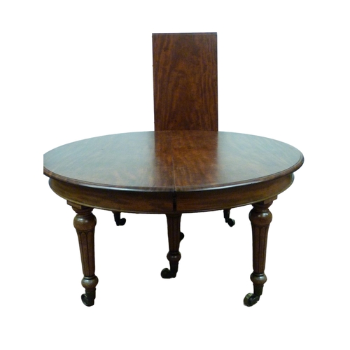 518 - Victorian mahogany circular extending dining table with one additional leaf, on six turned supports ... 