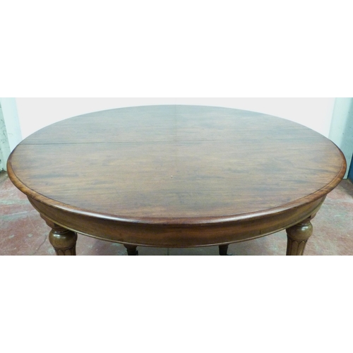 518 - Victorian mahogany circular extending dining table with one additional leaf, on six turned supports ... 