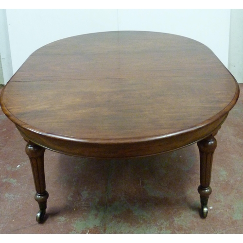 518 - Victorian mahogany circular extending dining table with one additional leaf, on six turned supports ... 