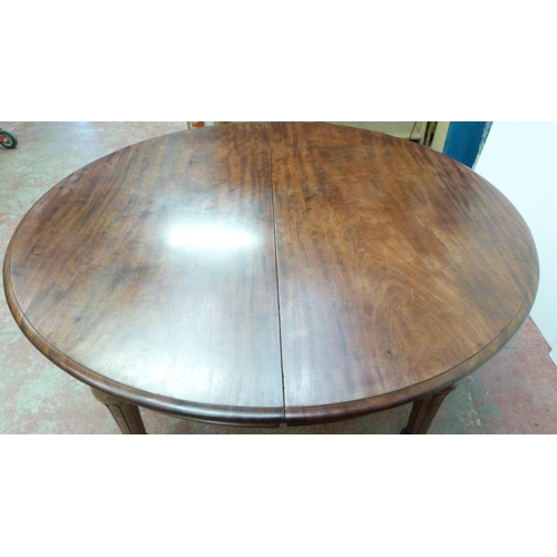 518 - Victorian mahogany circular extending dining table with one additional leaf, on six turned supports ... 