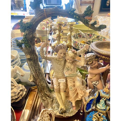 302 - Pair cherub candle holders, Capodimonte-style figure of man & woman, large piano figure, etc