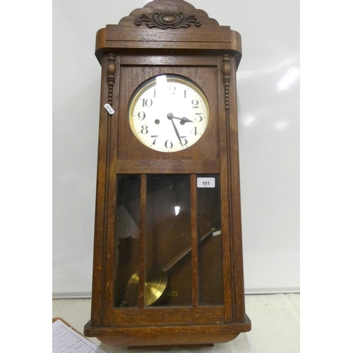 101 - Oak pendulum wall clock.