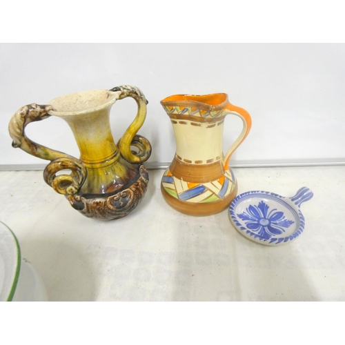 27 - Art pottery jug, a twin handled vase, a floral decorated chamber pot etc.