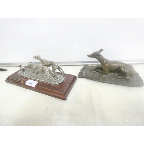 86 - Two vintage greyhound figure groups.