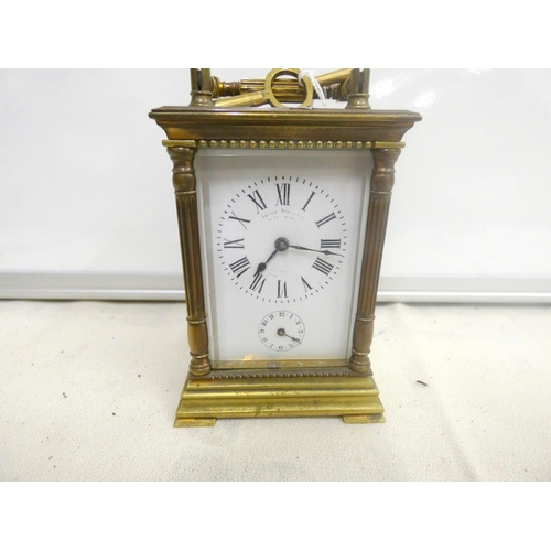 9 - Antique French, brass four glass panel carriage clock.