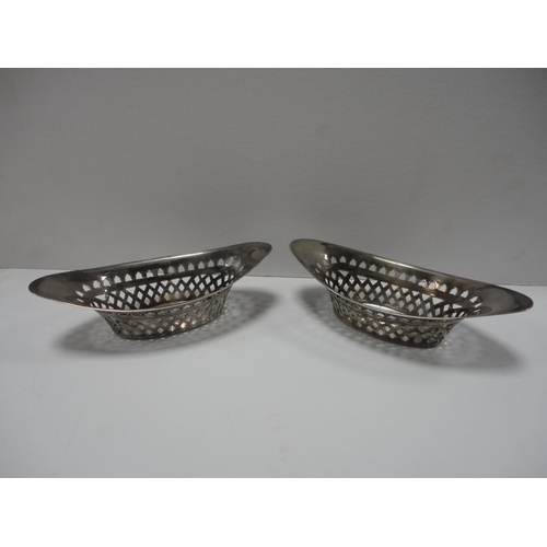 218 - Pair of pierced silver boat-shaped bon-bon dishes.