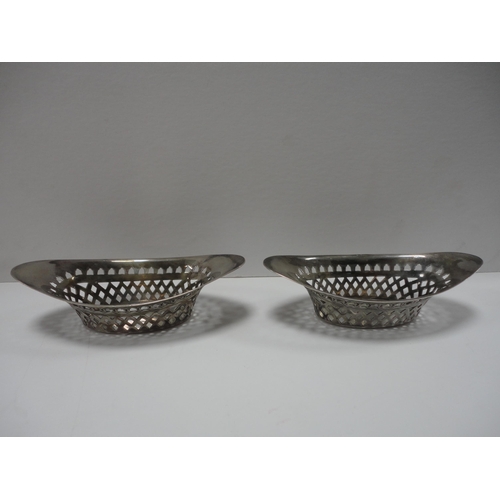 218 - Pair of pierced silver boat-shaped bon-bon dishes.