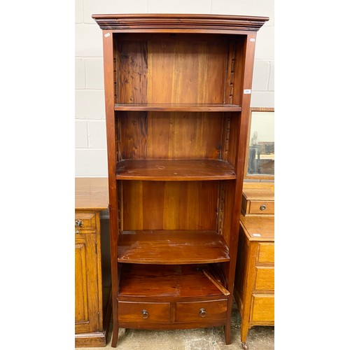 650 - Mahogany bow front open bookcase with two fitted drawers