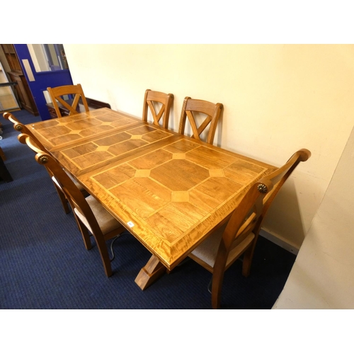 528 - Very large modern extending oak inlaid table with cross supporting legs and six matching chairs.L.23... 