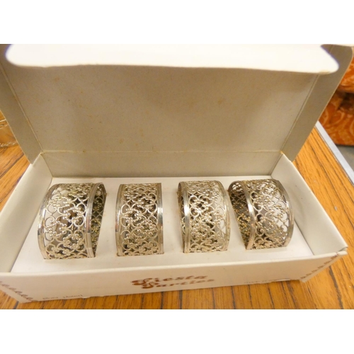 174 - Set of four epns napkin rings, boxed and other ep condiments.