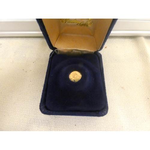 122 - Small 14ct gold 0.3 gram South African coin.