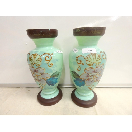 139 - Pair of Continental glass overpainted vases, 25cm high