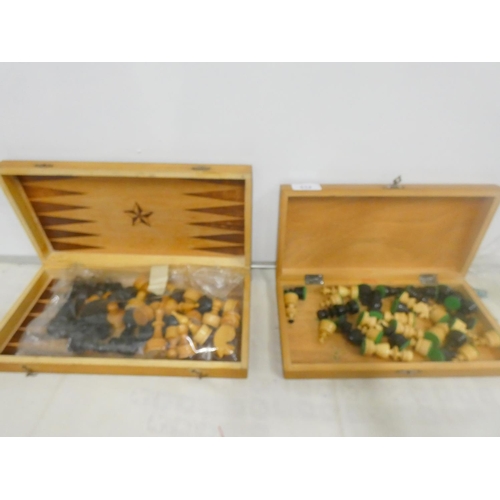 212 - Two boxed modern chess sets.