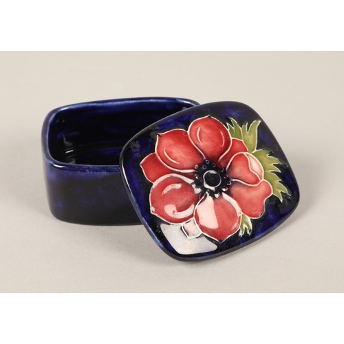 13 - Moorcroft pottery lidded pin dish in the anemone pattern, measures 3.5cm h x 7cm w x 6cm d