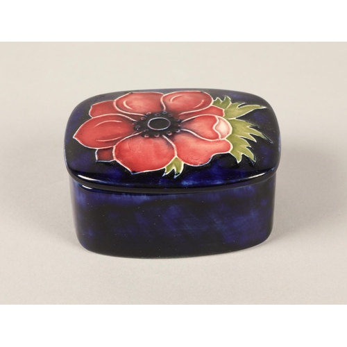 13 - Moorcroft pottery lidded pin dish in the anemone pattern, measures 3.5cm h x 7cm w x 6cm d