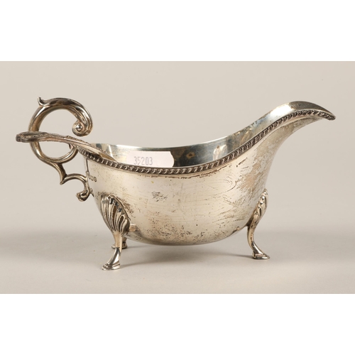 166 - Silver footed sauce boat, assay marked Sheffield 1940 by William Hutton & Sons Ltd. Total weight... 